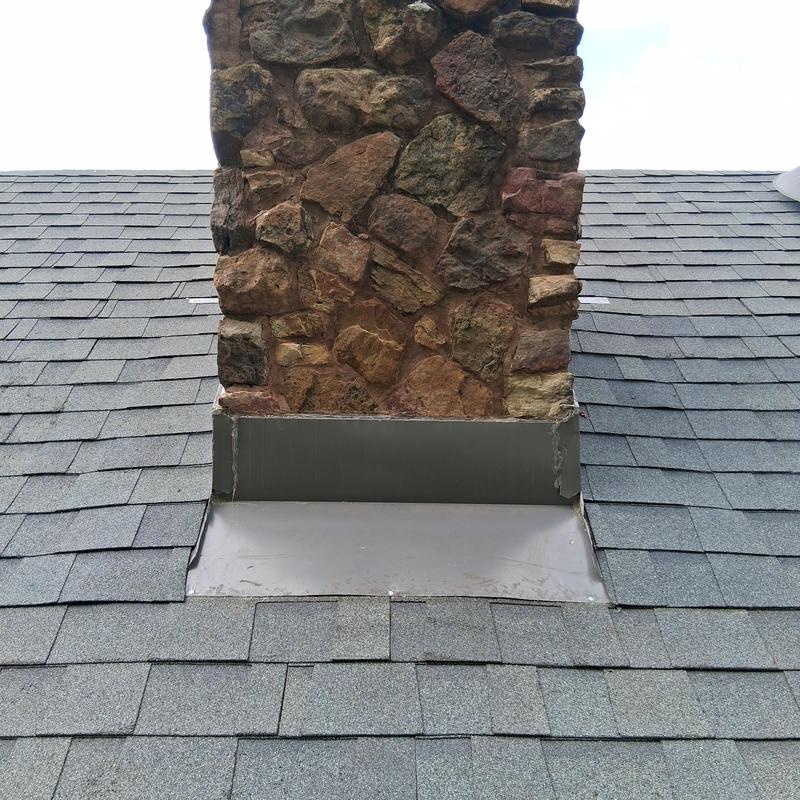 Replaced flashing around a chimney and installed new shingles on a roof in Florence, MS
