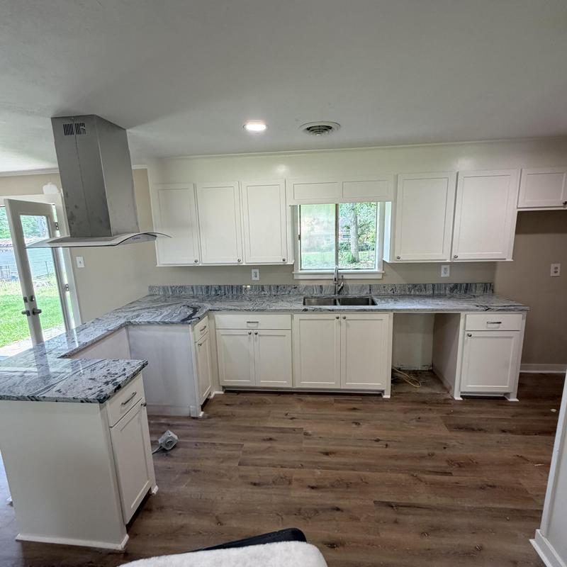 Completed a whole house remodel updating the kitchen with new countertops, doors, knobs in Pearl, MS