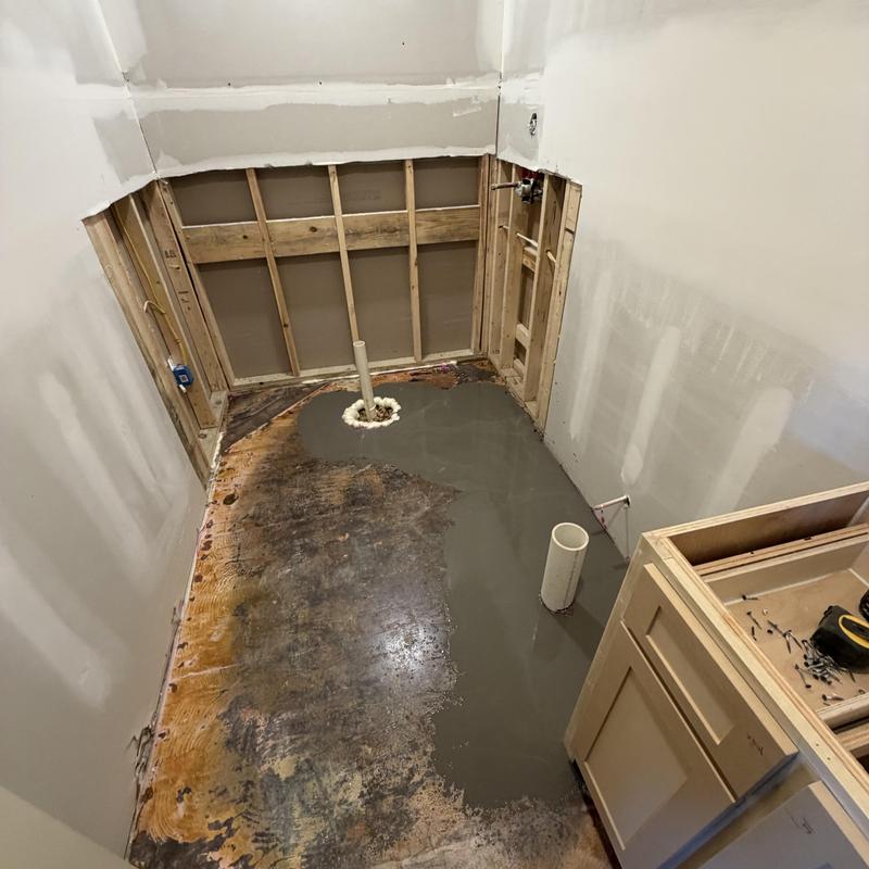 Applied a self-leveling compound to repair a bathroom floor ensuring a smooth in Florence, MS