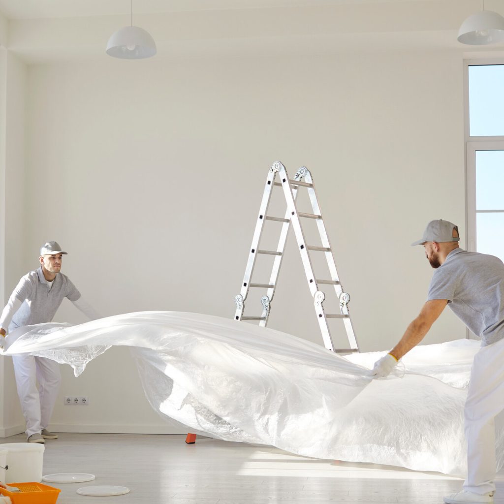 Interior painters prepare place for painting.